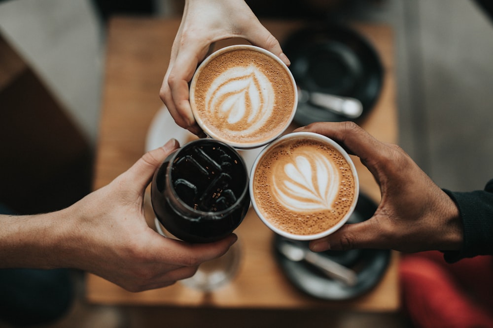 Fresh coffee being poured into a ceramic cup